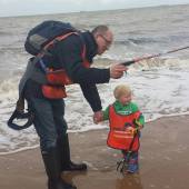 A young beach cleaner gets a bit wet   Photo Alex Fisher