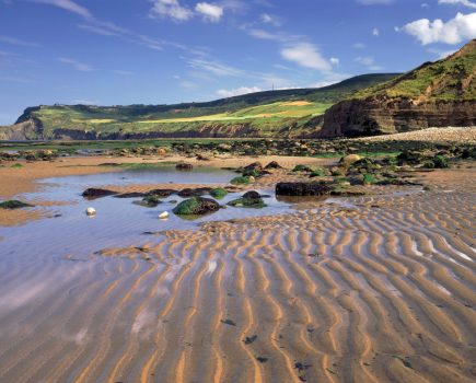 a_view_of_ravenscar_nt_from_the_beach_at_boggle_hole_north_yorkshire_cnational_trust_images_joe_cornish
