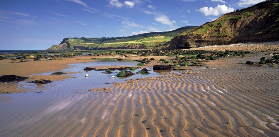 a_view_of_ravenscar_nt_from_the_beach_at_boggle_hole_north_yorkshire_cnational_trust_images_joe_cornish