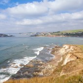 South Devon’s Bigbury-on-Sea is close to us but we only enjoy it in the winter when it’s quiet. It’s a fabulous set-up with steep cliffs, big waves and rolling Devon hills.