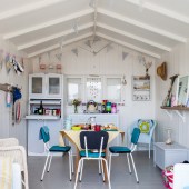 White walls and retro furniture are enhanced by bright accessories