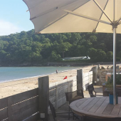 Watch the world go by from a beach-side terrace
