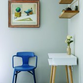 The blue chair in the spare room is a Tolix, while the desk came from Habitat