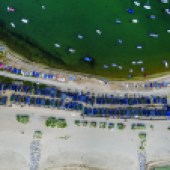 Beach huts and boats at Mudeford Spit in Dorset, UK. A vertical view from 400ft. Photo: Fergus Kennedy