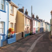 Multi-coloured, terraced houses on a street in Appledore, North Devon. Image: antb/Shutterstock