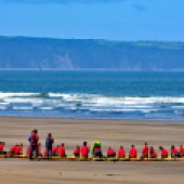 Teams of young people on the beach at Westward Ho! being trained in how to surf safely. Image: North Devon Photography/Shutterstock