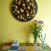 Kay’s Copenhagen wall relief decoration sits above the kitchen table