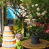 The ceramics provide a pretty backdrop for the garden roses