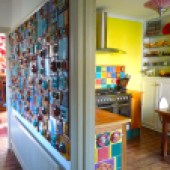 A view of the brightly decorated hallway and kitchen