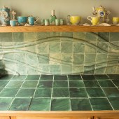 The tiled relief in the utility room uses more muted colours