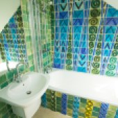 The bathroom where it all began with Llandbradach Spires tiles in blues and greens