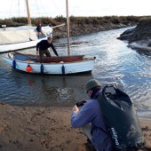 Colin eases the mussel flat to dry land