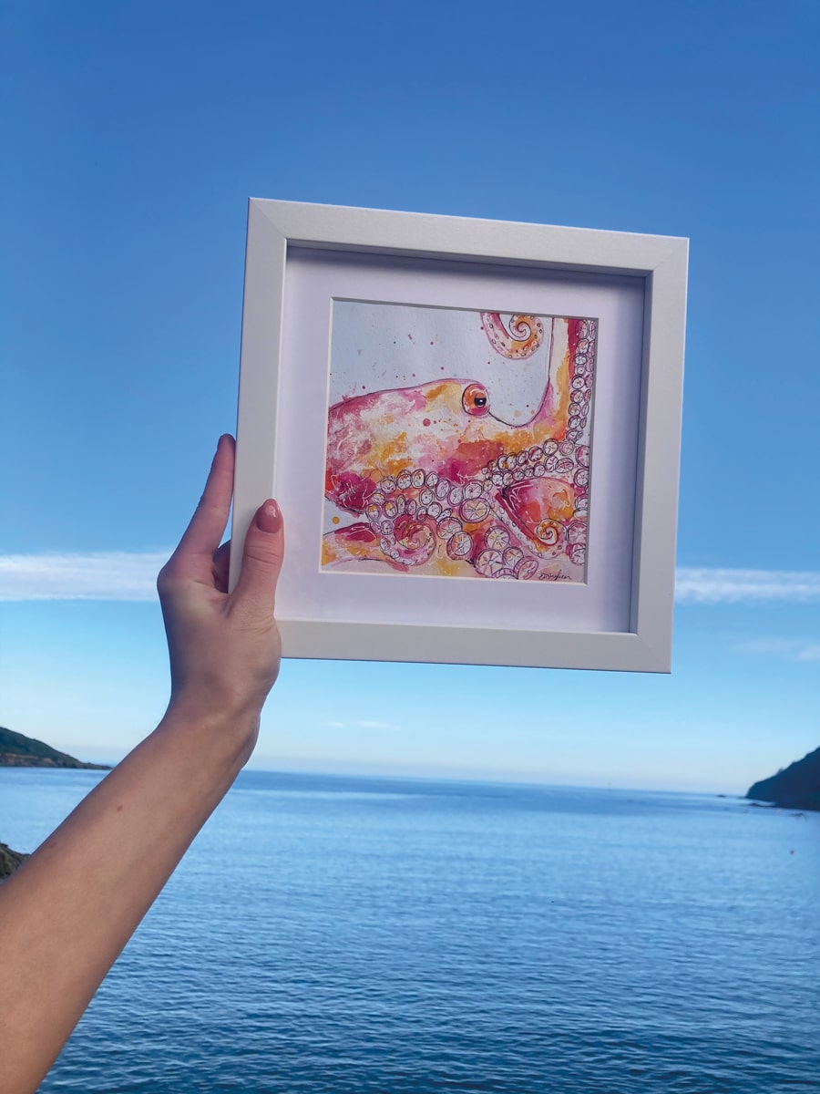 One of Elisha's artworks, called Pink Octopus; every painting is made using a little drop of seawater that Elisha collects at the place that inspired that picture
