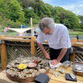 Mark Hix shucking oysters. Photo credit Matt Austin