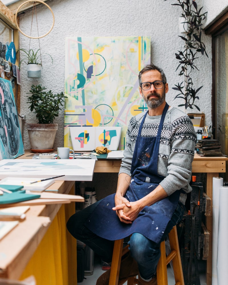 Surrounded by his art, in the studio attached to his house - photo credit Adj Brown