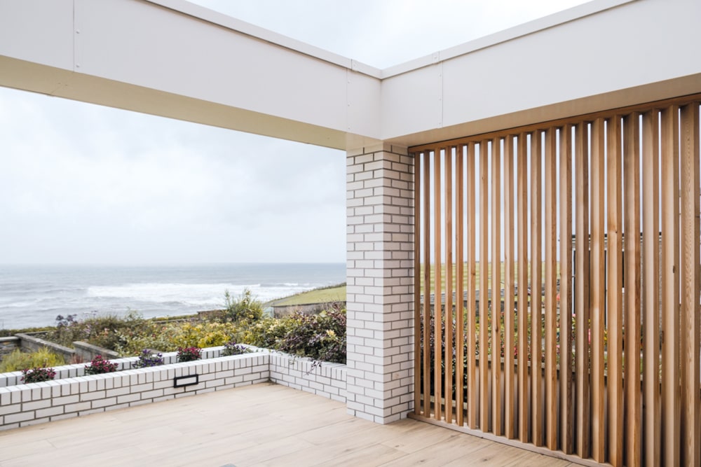 Sustainable, durable materials such as timber and brick respect the elements and help the house to blend in with the landscape - it feels like it belongs within its environment. Photography Katie Pryde.