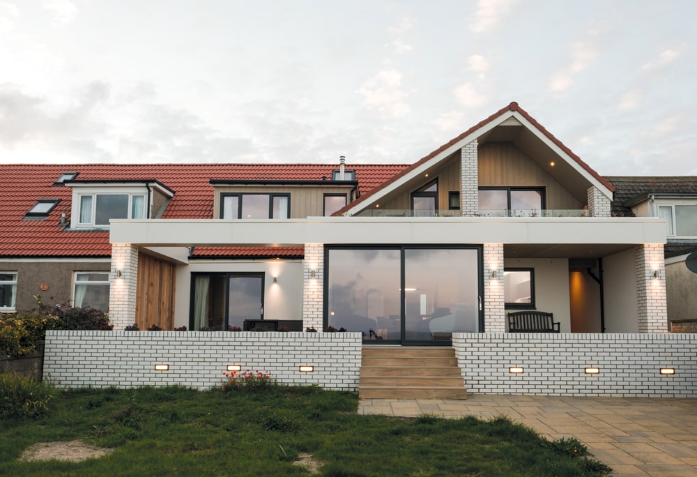 The uneven roof pitch mirrors the shape of the isle of May, a National Nature Reserve in the Firth of Forth which can be seen from almost every room in the house. Photography Katie Pryde.