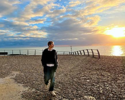 Artist Louise Body by the coast at Hastings, where she has lived for almost two decades. Photo credit kingandmcgaw.com and louisebody.com