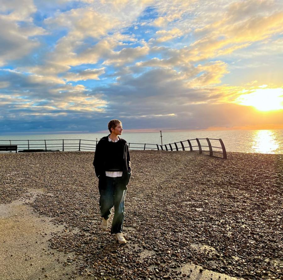 Artist Louise Body by the coast at Hastings, where she has lived for almost two decades. Photo credit kingandmcgaw.com and louisebody.com