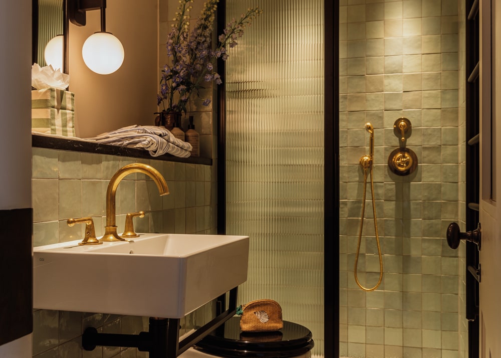 Bathrooms feature fluted glass and antiqued brass at No. 124, Brighton