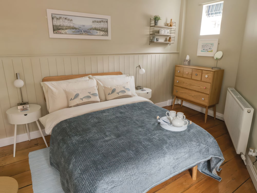 The bedroom boasts luxury linens for lazy duvet days - Oakridge Cottage