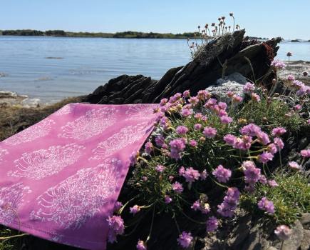 The Sea Pink tea towel is inspired by thrift flowers