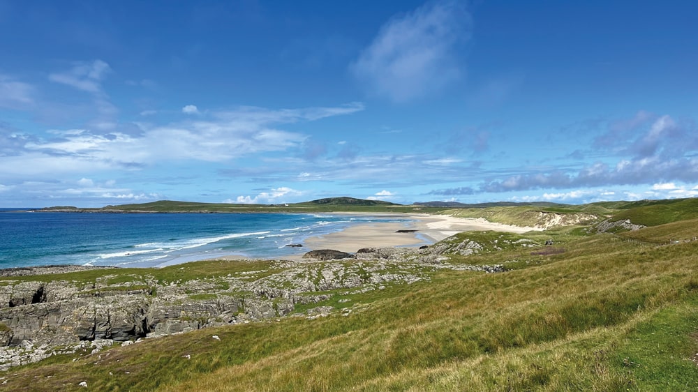 Craggy rocks and a golden sandy beach on Isle of Islay