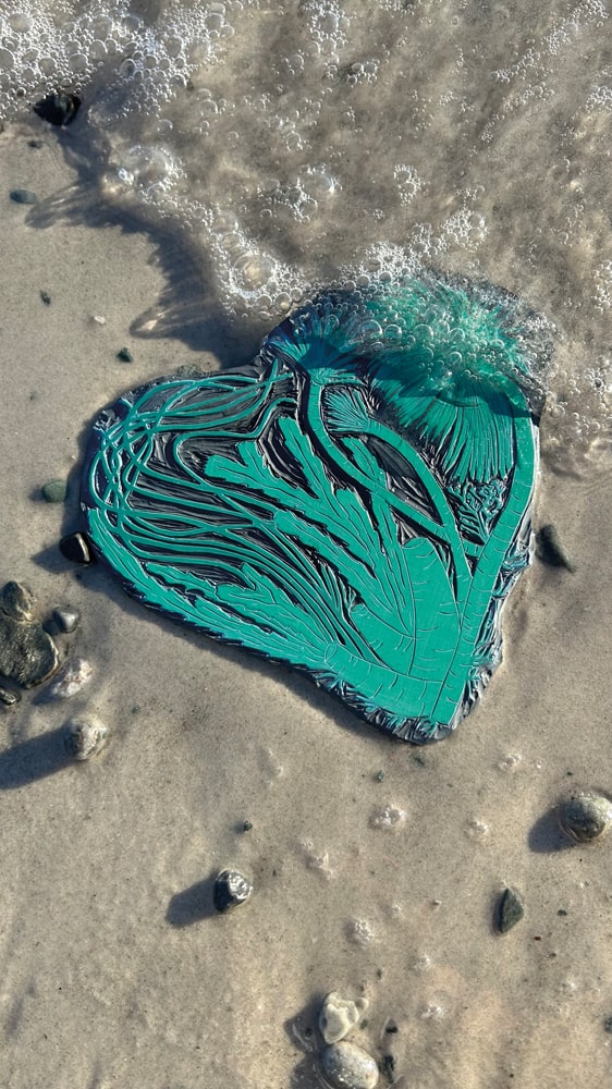 Designed in 2024, the Underwater Love linocut features peacock worm