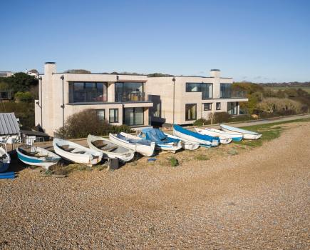 The two homes were built ‘upside down’, with living areas on the top floor to make the most of the views of Pett Level Beach