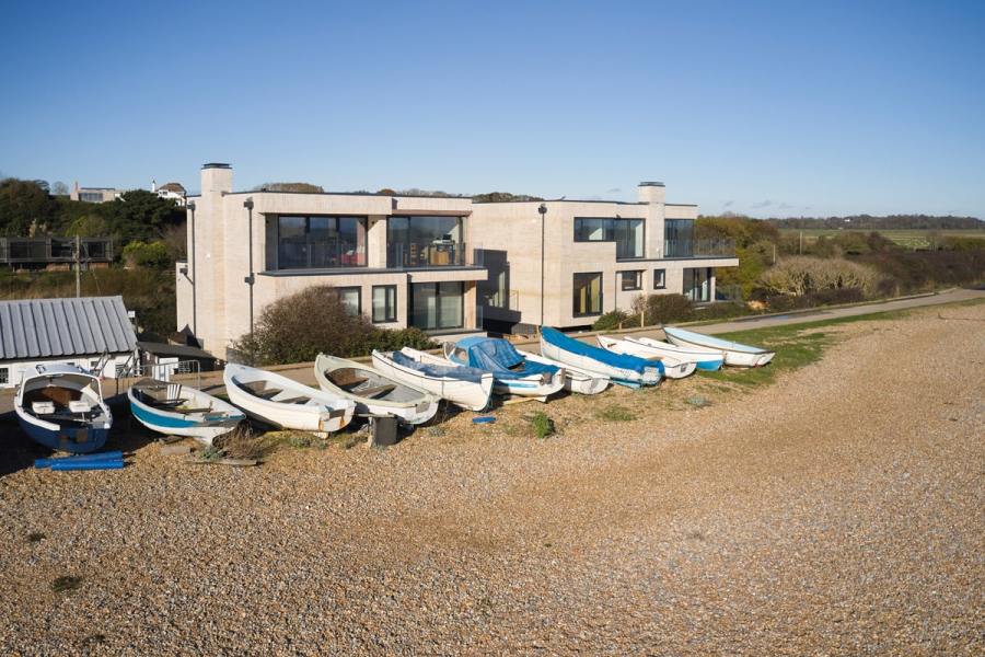 The two homes were built ‘upside down’, with living areas on the top floor to make the most of the views of Pett Level Beach