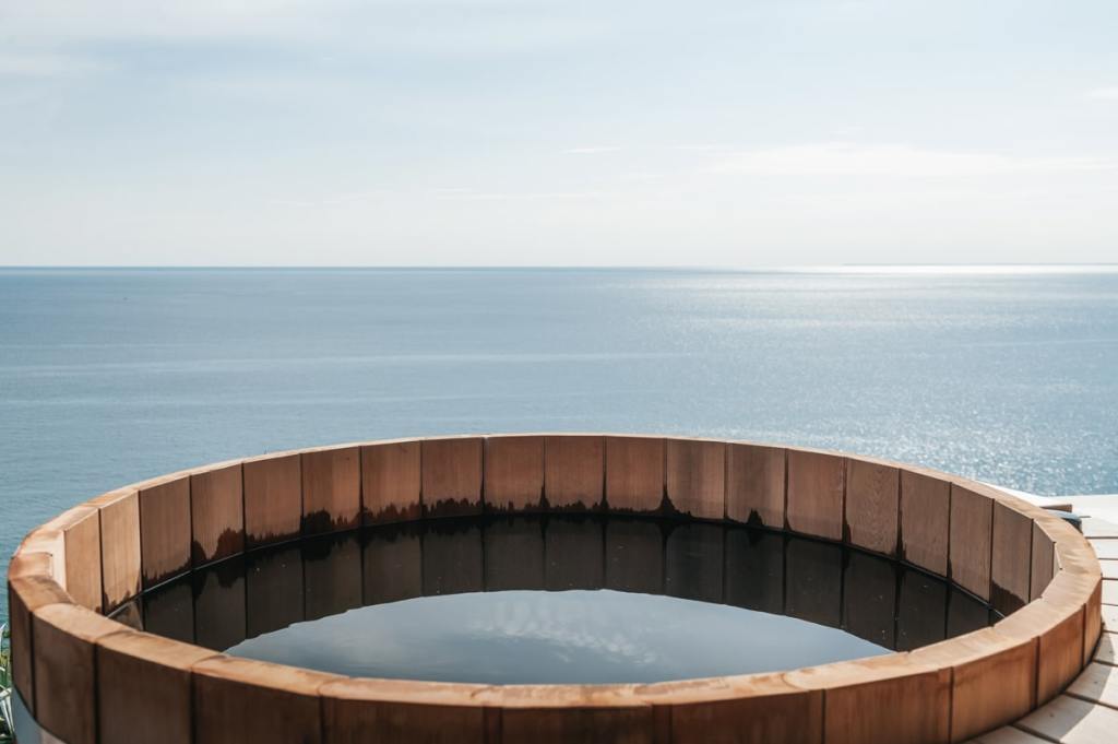 The features include an outdoor hot tub crafted from aromatic cedar wood 

