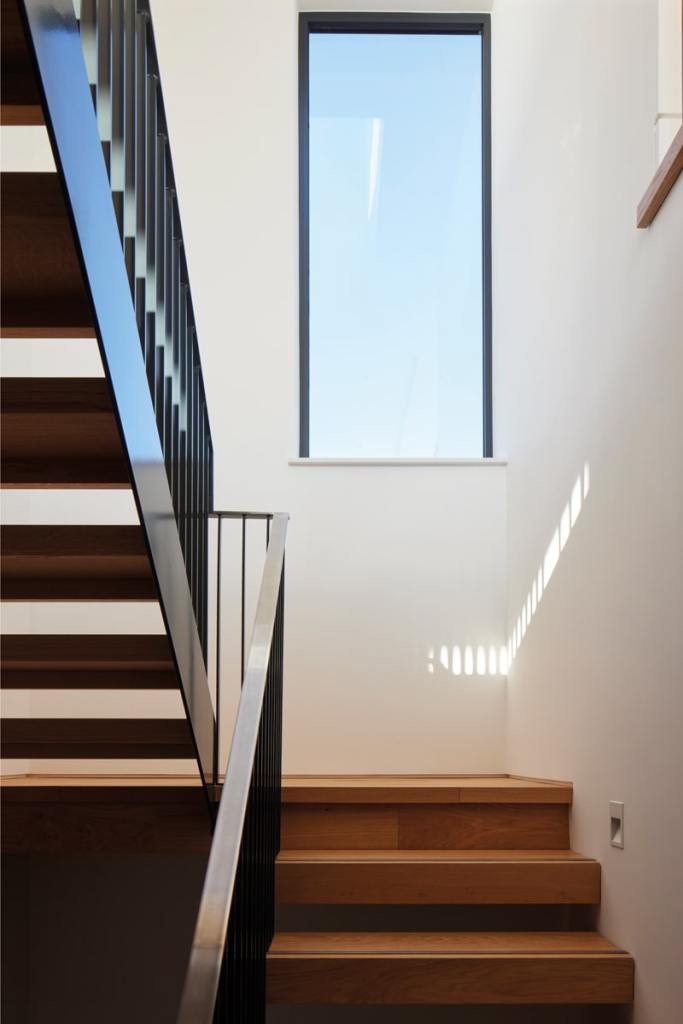 An elegant staircase – one of the houses also features a lift to enable multigenerational living