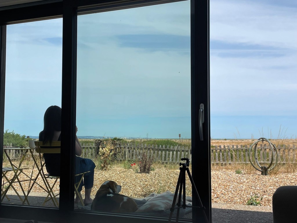 Helen Wilde contemplating a coastal view