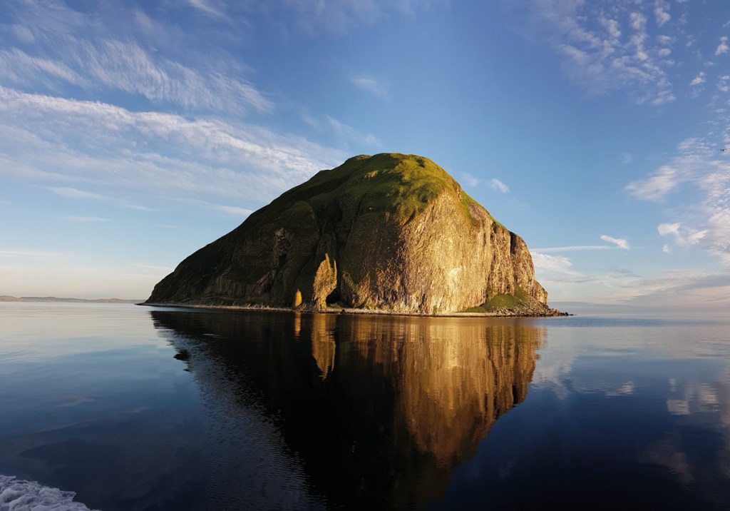 An imposing view of Ailsa Craig island from the water