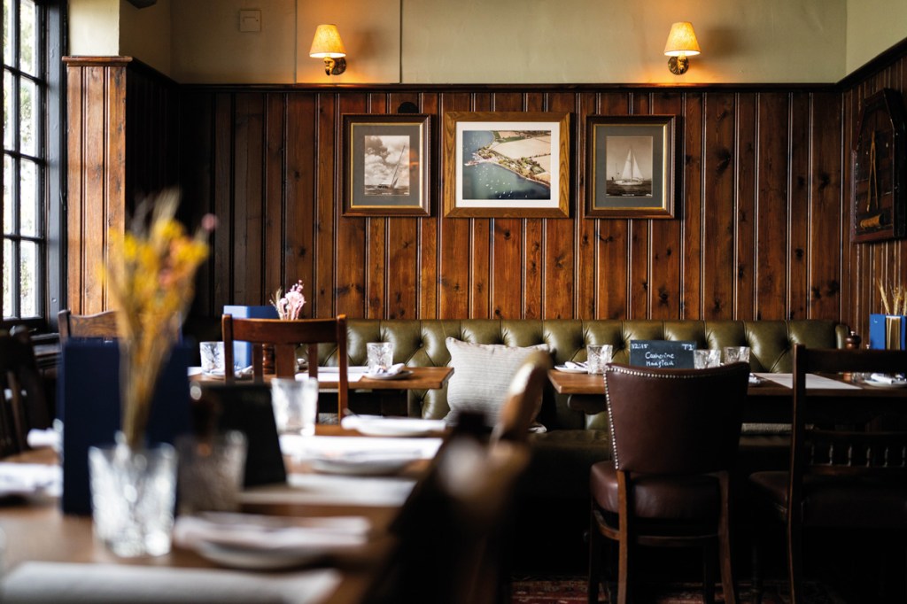 Pictures on 
the wall reflect the pub’s coastal location. Photography Matt Austin