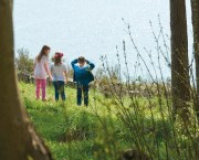 Children looking out to sea from the grounds of Coleton Fishacre, South Devon. Photography National Trust Scotland, ©National Trust Images/Trevor Ray Hart