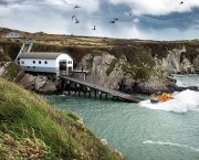 St Davids Tamar class lifeboat Norah Wortley 16-26 being launched down the slipway for a training exercise. Splash and White Spray as the lifeboat hits the water.